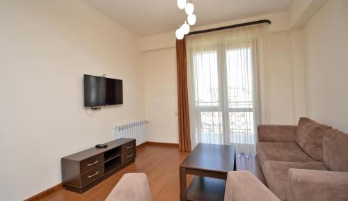 One-Bedroom Apartment with Balcony and City View