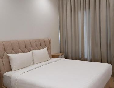 One-Bedroom Apartment with Balcony and City View