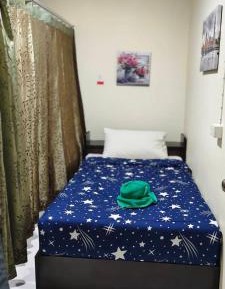 Single Bed in Dormitory Room
