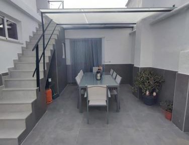 Four-Bedroom Apartment with Balcony 