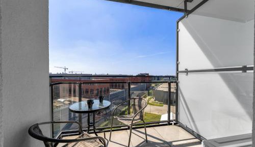 One-Bedroom Apartment with Balcony and City View