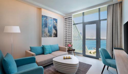 Superior One Bedroom Sea View Suite with Balcony, Kitchen, Evening Drinks & Canapes Section, Complimentary Airport Transfer, Beach & Rooftop Infinity Pool Access, Shuttle to Mall Of Emiratesimentary Airport Transfer  ,Shuttle to Mall Of Emirates