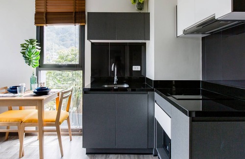 Patong Apartment | Walk to Patong Beach from a Sleek, Daylit Apartment