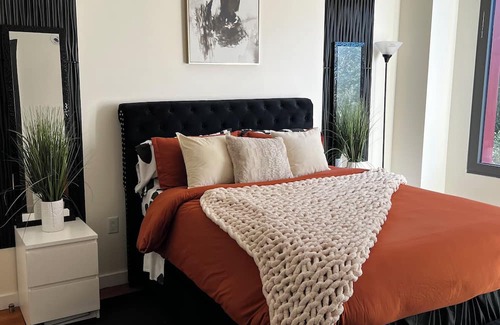 East Williamsburg Condo | Electrifying 1-bedroom condo with Bowling, Pool, Theater and Rock Climbing!