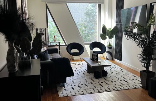 East Williamsburg Condo | Electrifying 1-bedroom condo with Bowling, Pool, Theater and Rock Climbing!