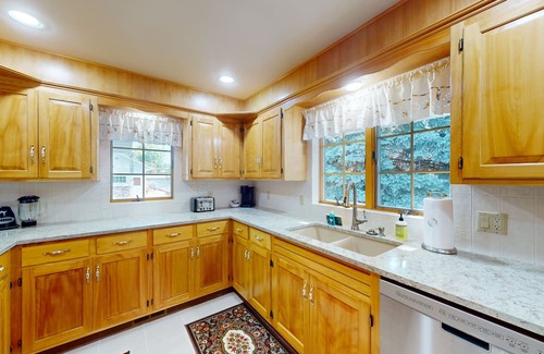 Post Falls House | Beautiful riverfront home with private dock, patio, pool table, WiFi, and W/D
