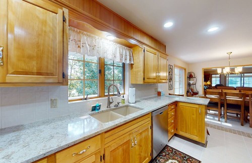 Post Falls House | Beautiful riverfront home with private dock, patio, pool table, WiFi, and W/D