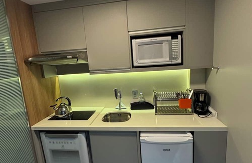 Agua Verde Apartment | Complete studio in Batel, Wi-Fi, kitchen and dining/work table