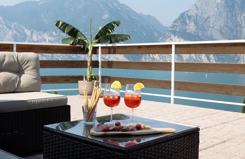 Torbole sul Garda Apartment | Exclusive residence in Torbole with breathtaking views, large terrace.