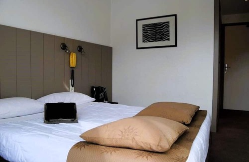 Lourdes Hotel | Enjoy Homelike Comfort & Balcony Sights w/Modern Amenities in Lourdes
