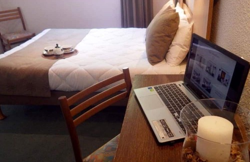 Lourdes Hotel | Enjoy Homelike Comfort & Balcony Sights w/Modern Amenities in Lourdes