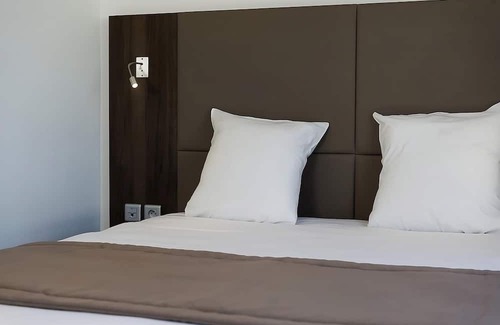 Dijon Hotel | Unwind in a Comforting Room with Nearby Tram to City | Free Offsite Parking