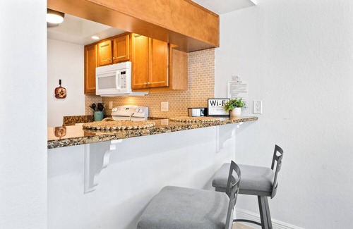 Avon By The Sea Condo | Coastal Comfort Steps from Cocoa Beach Pier W/Heated Pool, BBQ Grills & Private Balcony