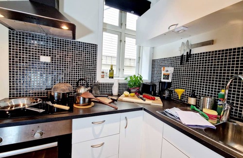 Engen Apartment | Prime location, amazing king bed, colorful oasis