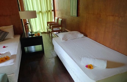 Sigiriya Resort | Eco-friendly Eighth Wonder lodge bedroom resort with AC, Wi-Fi in Sigiriya
