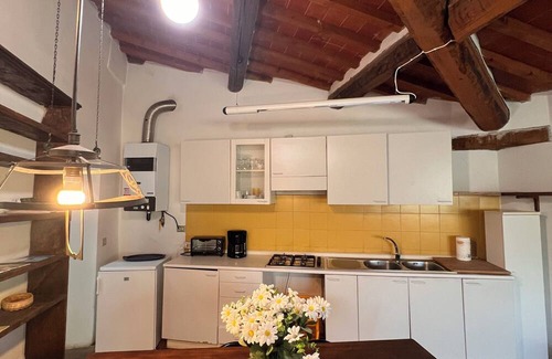 Pieve a Presciano Apartment | Penthouse with large windows and frescoes in hamlet with pool use
