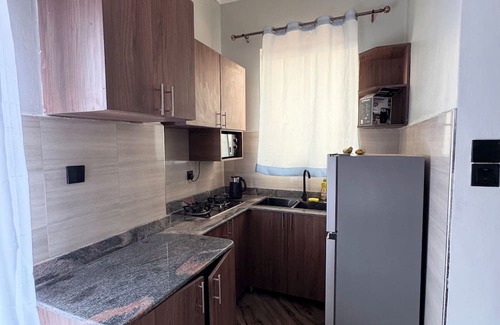 Kampala Apartment | Cozy 1-bedroom Studio apartment in charming Kampala with WiFi, AC and Netflix