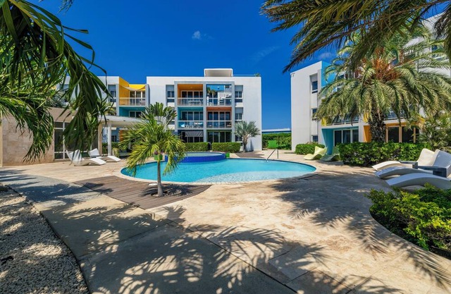 Gated community with resort-style amenities - 2 bedroom, 2 bath with an open concept living room and kitchen. Private balcony overlooks pool area.