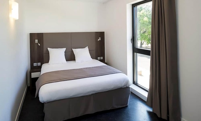 Dijon Hotel | Unwind in a Comforting Room with Nearby Tram to City | Free Offsite Parking