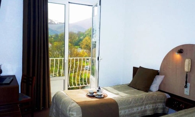 Lourdes Hotel | Relax in Comfort, Pet-Friendly, Free Parking, Onsite Restaurant, Scenic Views!
