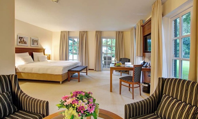 Ootmarsum Hotel | Beautifully Lit Room Overlooking Lush Parkland in Ootmarsum with Wellness Area